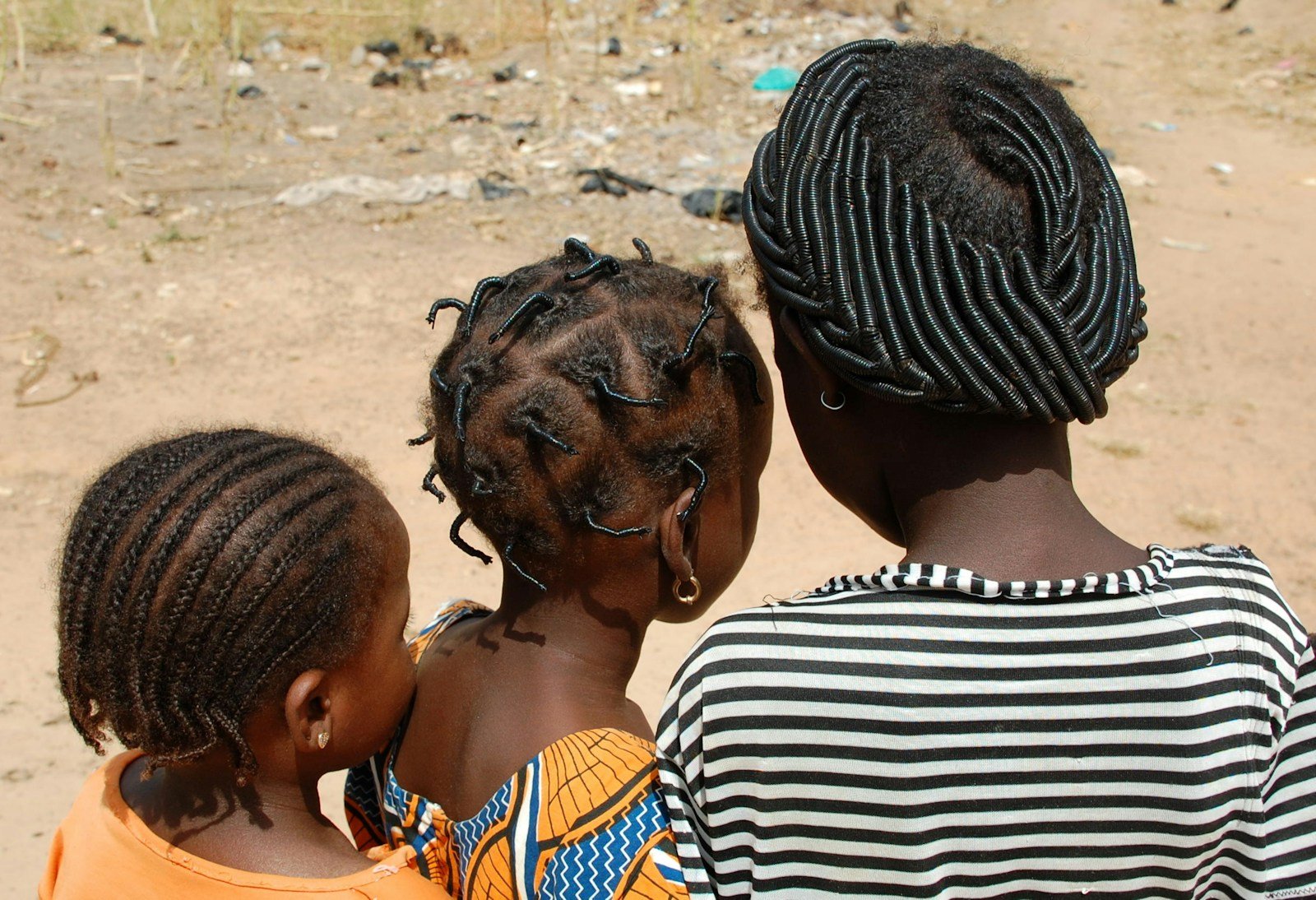 A group of young children standing next to each other
